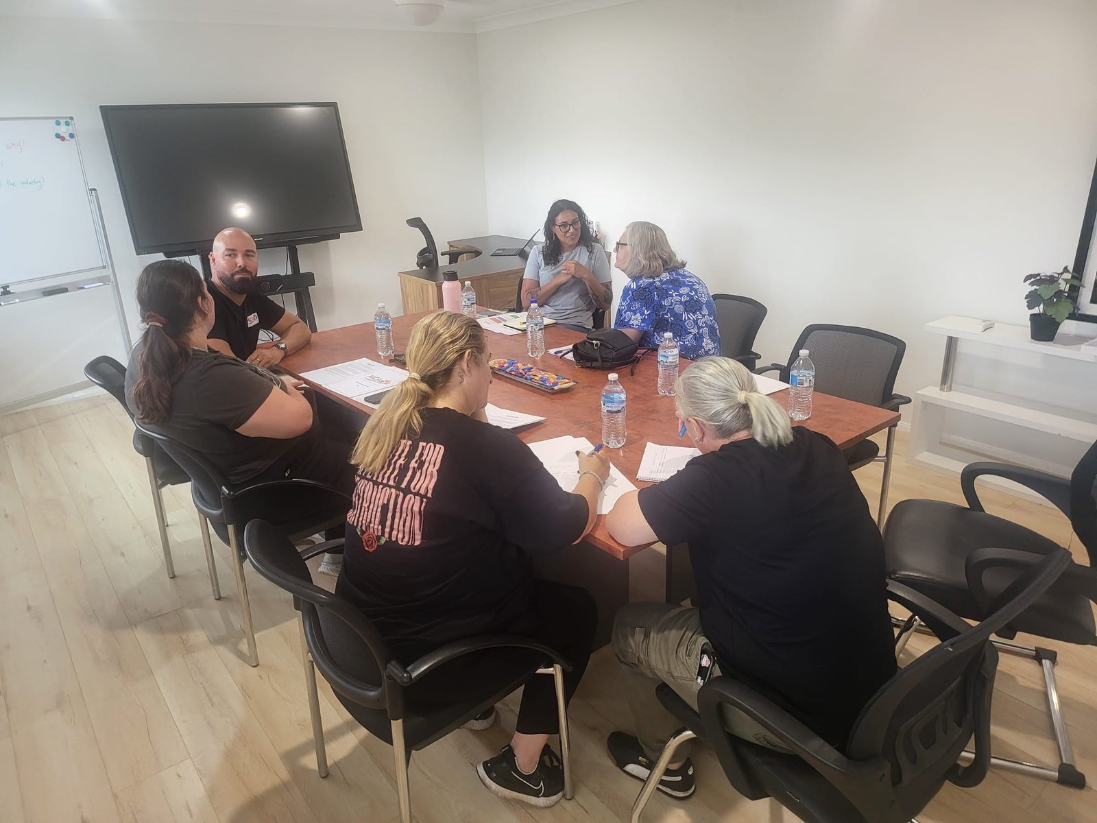 NDIS provider team discussing compliance